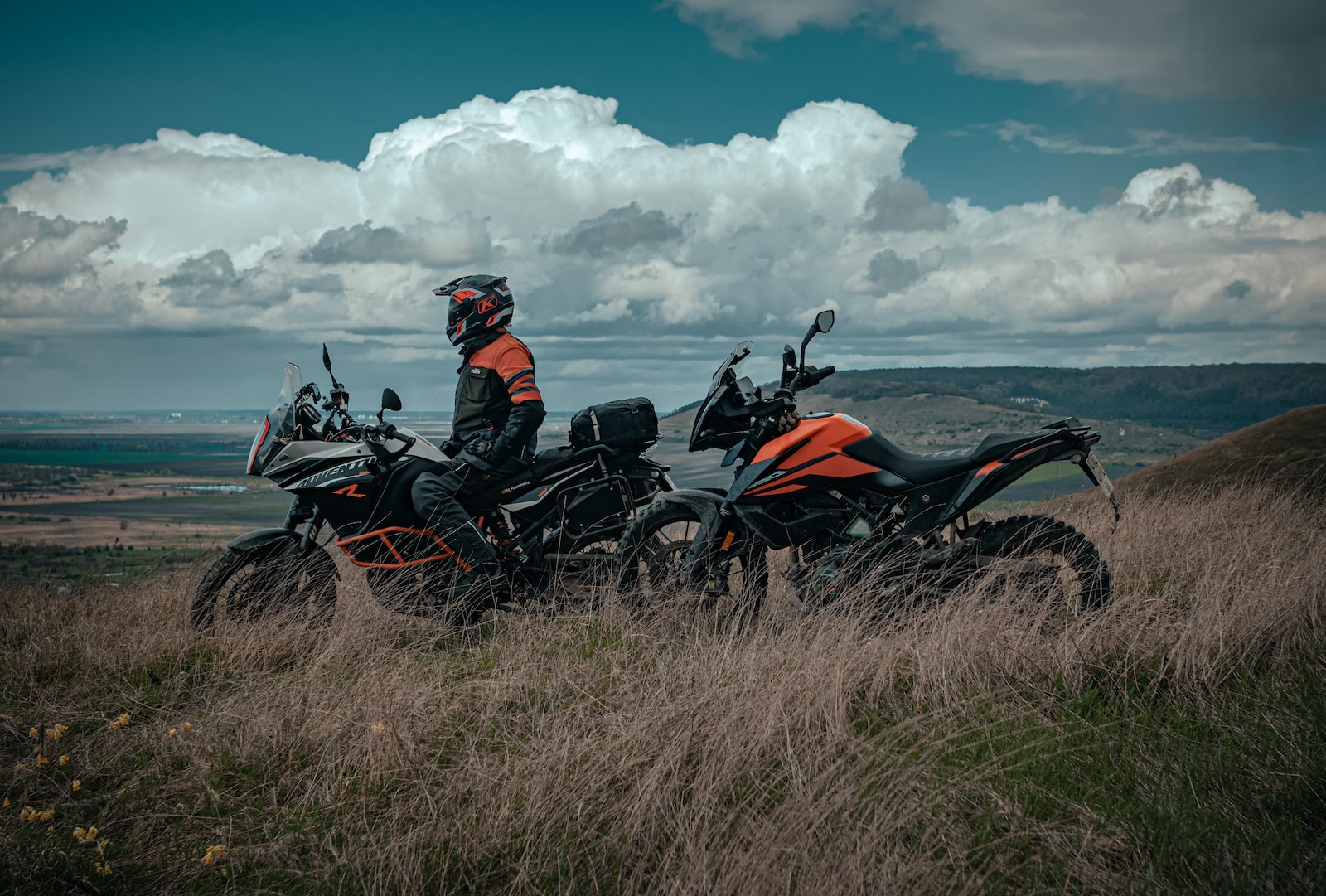 man riding on red and black sports bike